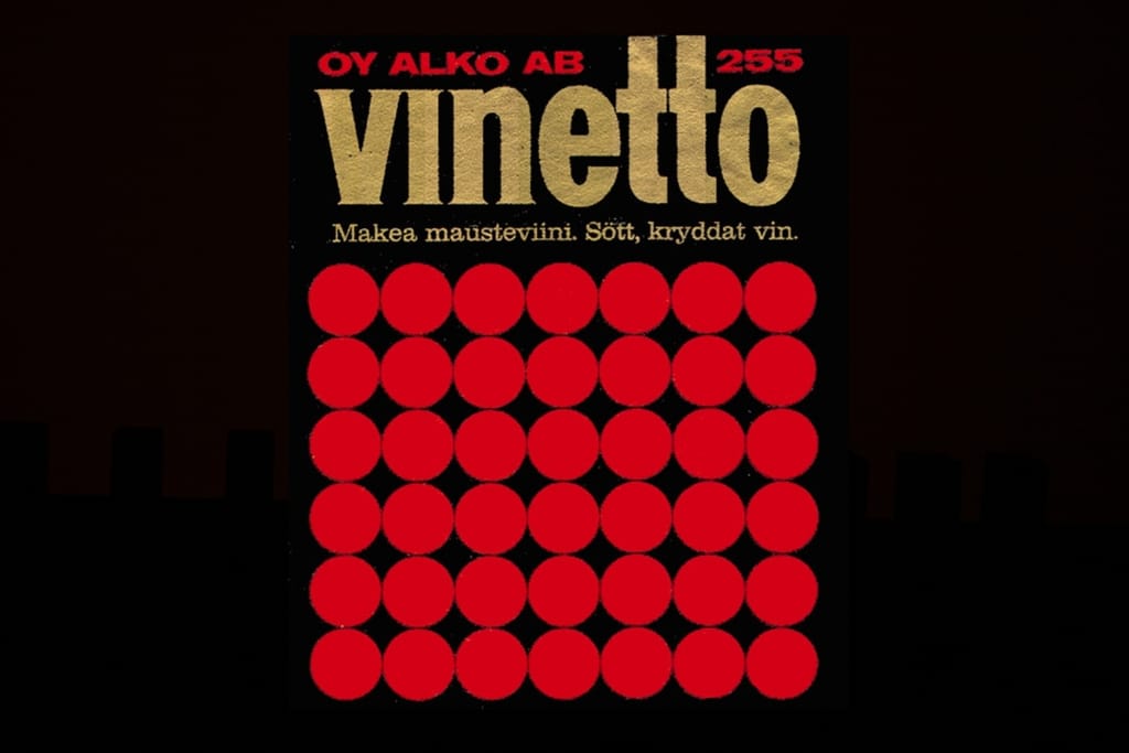 Vanha Alkon Vinetto-etiketti, jossa on punaisia ympyröitä mustalla pohjalla.